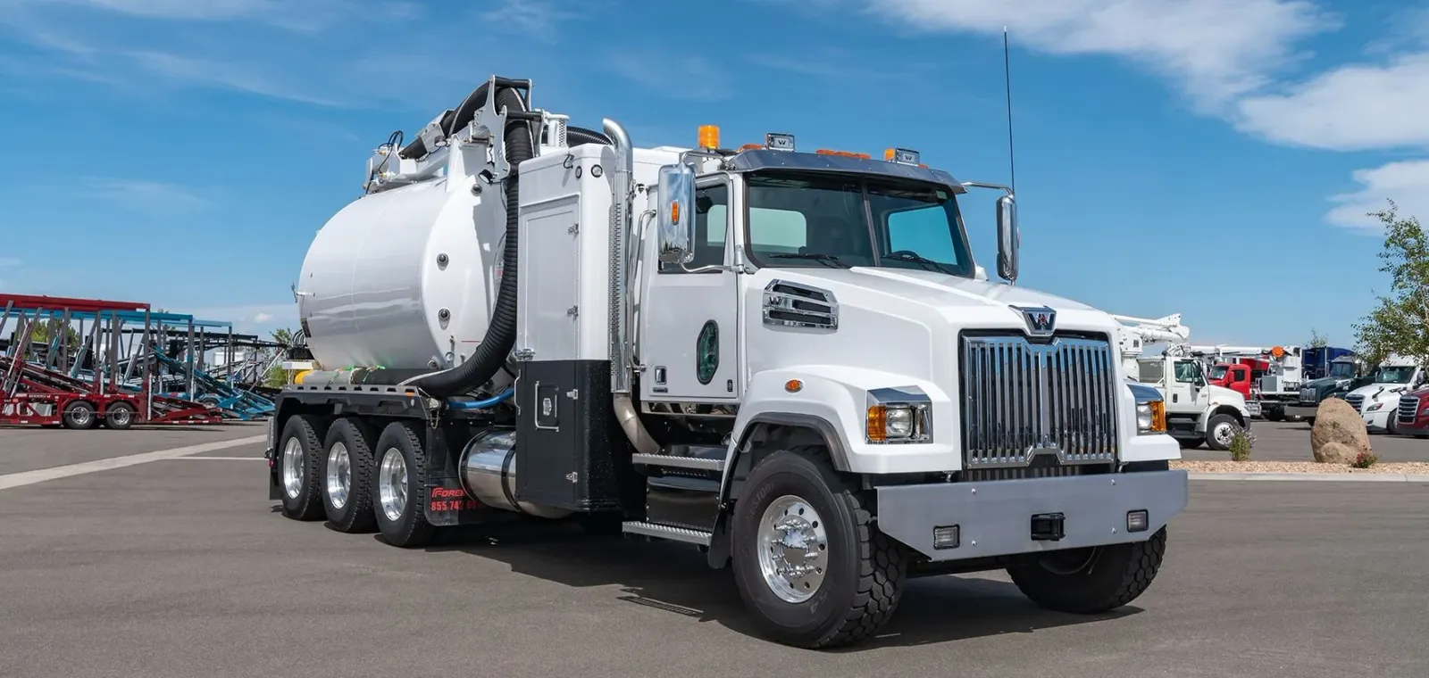 A white hydrovac truck